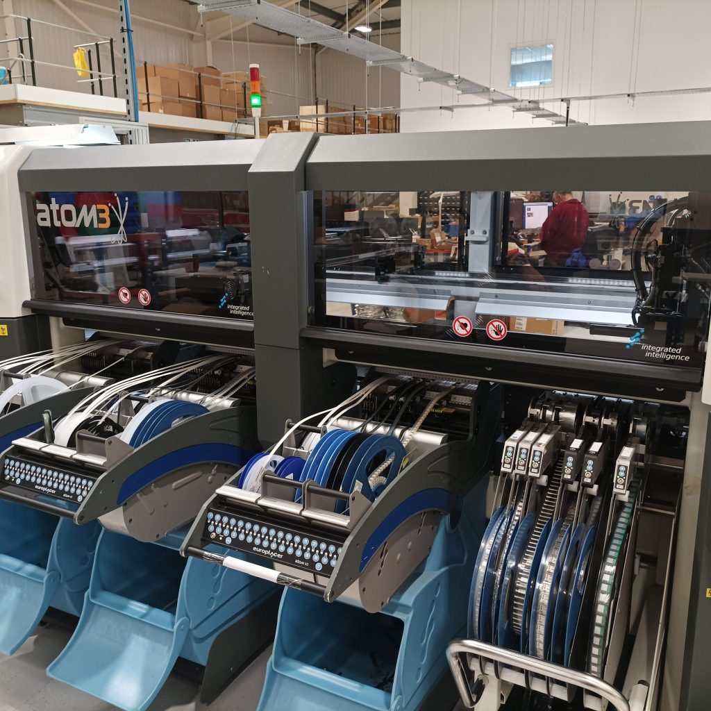 Reels of components supply the pick and place machines
