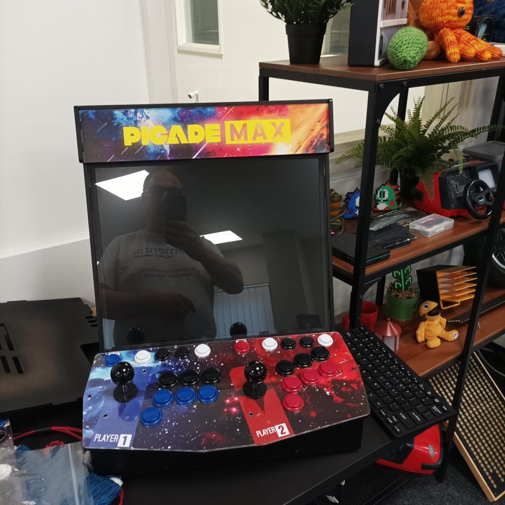 Front of the picade with 2 joysticks each with 7 buttons