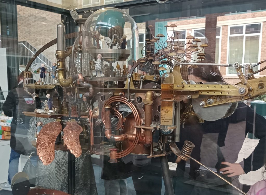 A mechanical whale, 2018 by Matthew Lane Sanderson and Rachel Wood. It is a fantasy Zoological airship, the crew of the whale include; past and present eminent Professors of Zoology, a curator, technicians, young students and resident artists.