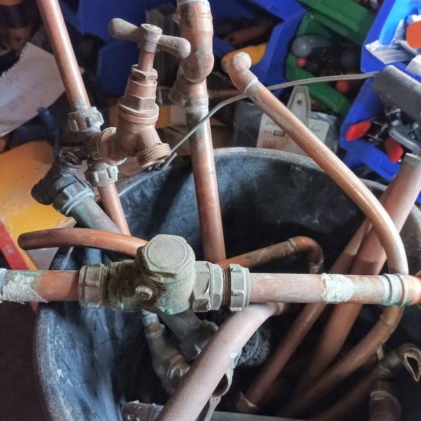 Copper pipes in a bucket