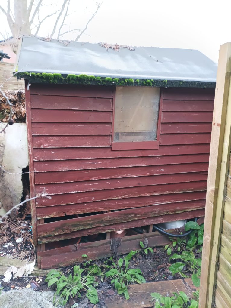 An old shed with a wonky side