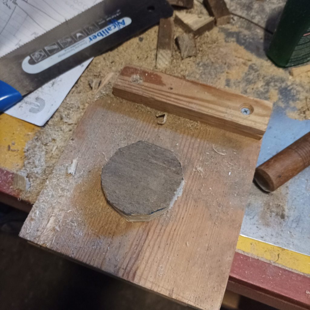 Block is now a wooden disk, resting on a bench hook