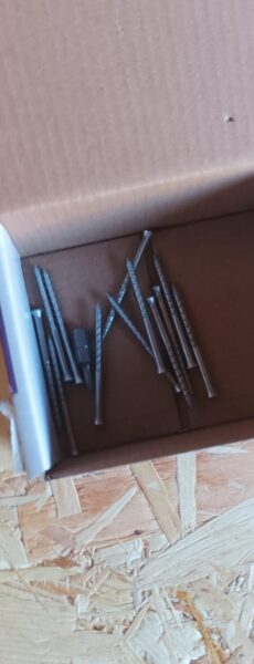 A box of long thin screws with a torq hexbit